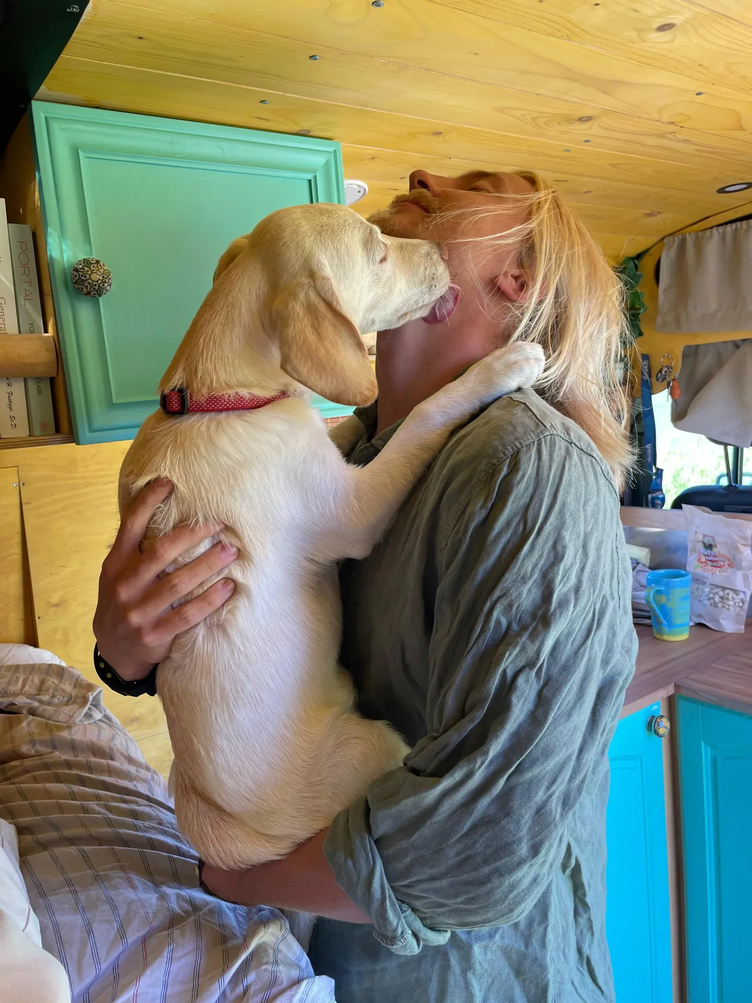 Bispo greeting his adopter in the family van