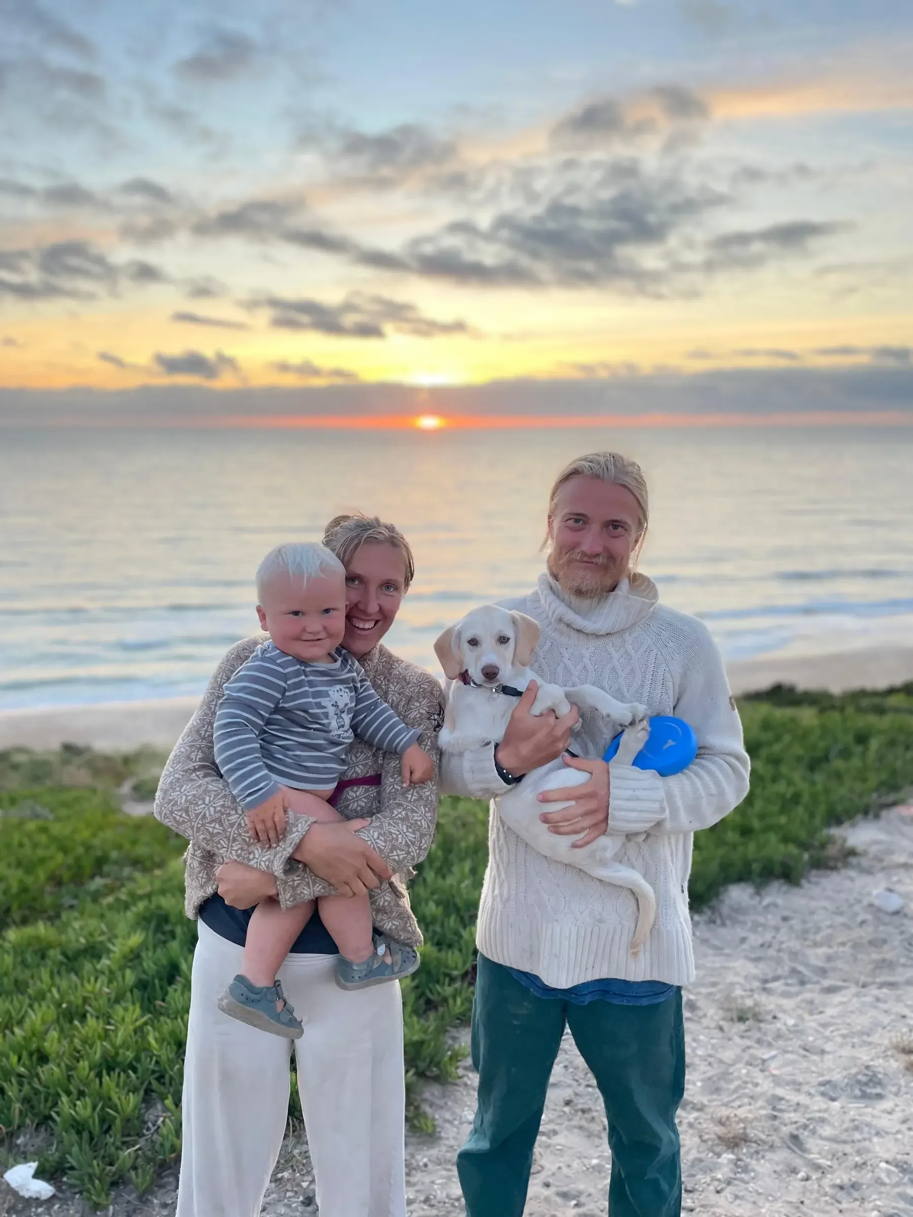 Bispo with his adoptive family outdoors at sunset