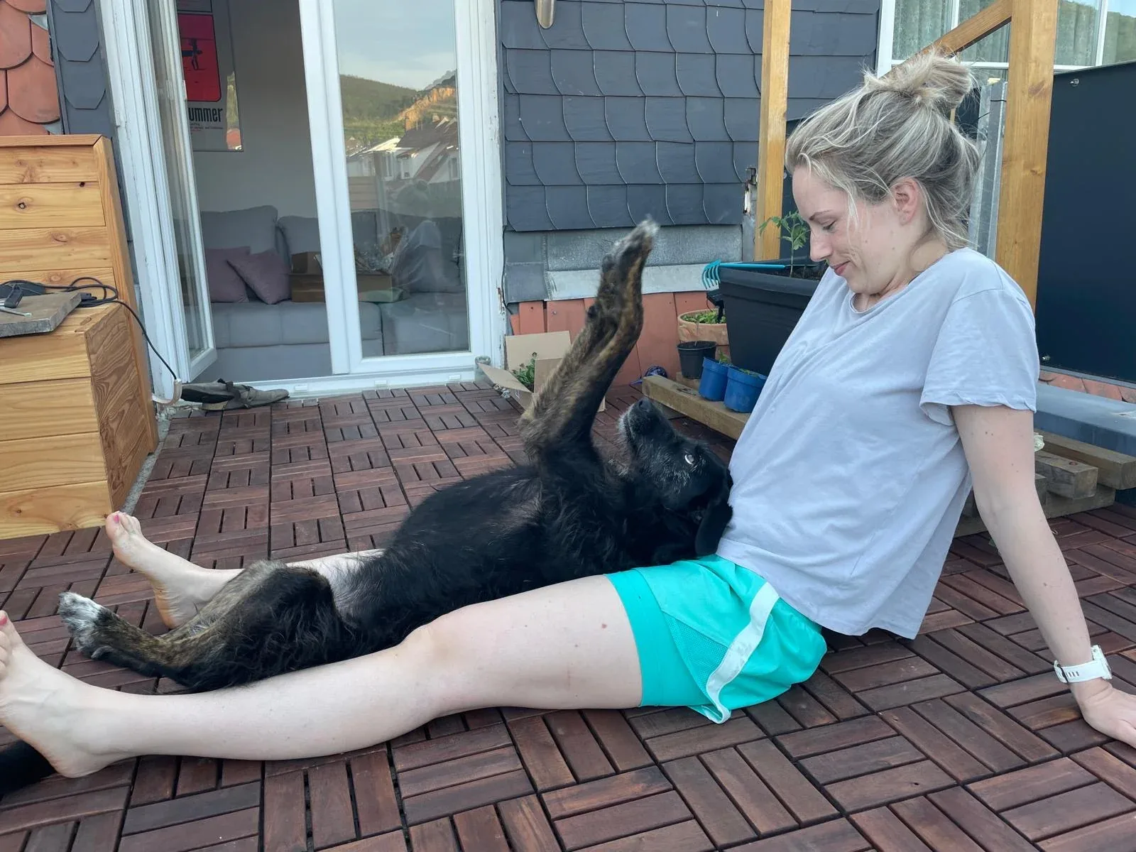 Polly relaxing with a family member on the terrace