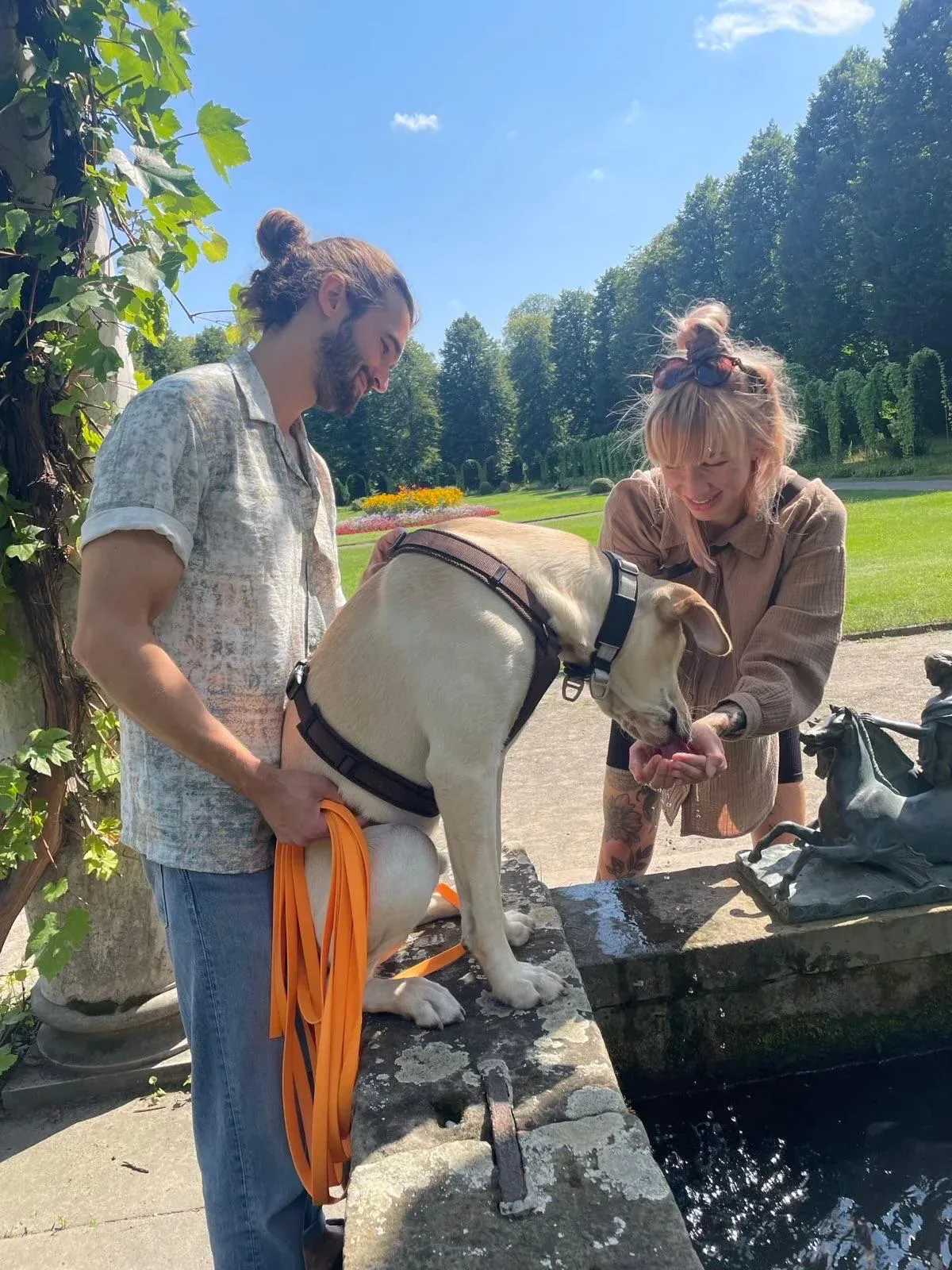 Seppi standing with Laura and Jakob outdoors